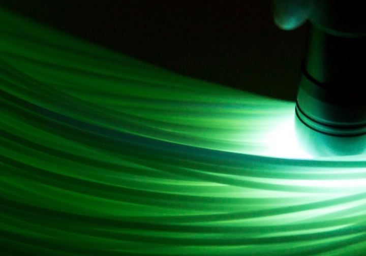 The eco-friendly FishFiberLight fishing line, developed by Cadilhe & Santos and CeNTI, shows its natural luminescence with a bright green glow in a dark environment.