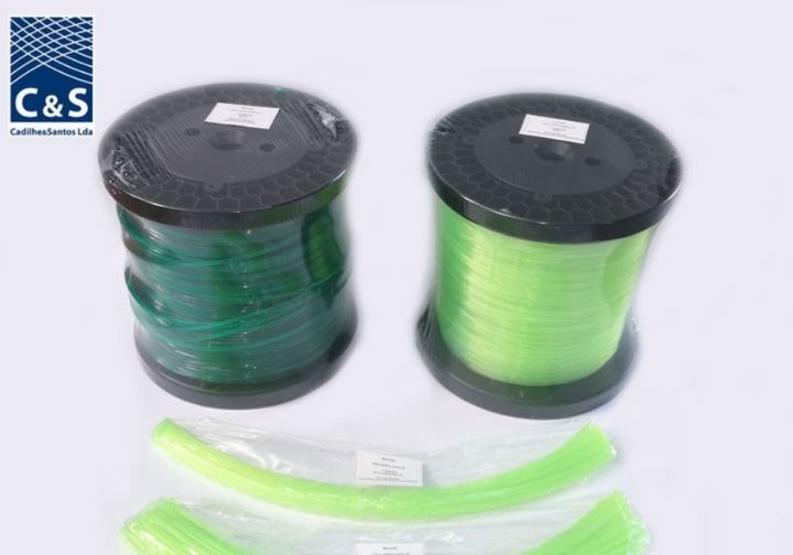 Two examples of trimmer lines used in brush cutters—one dark green and one fluorescent green